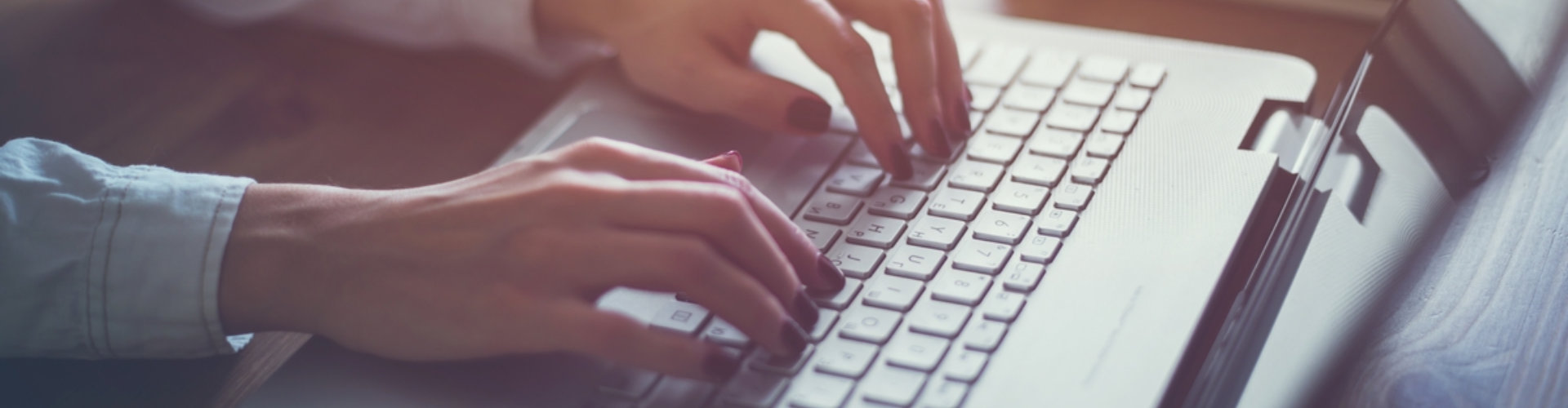 staff typing on the laptop