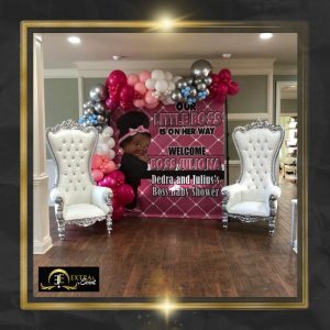 a baby shower party with balloons and chairs