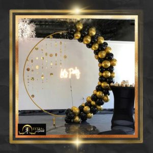 black and gold balloon arch